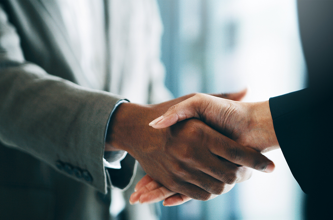 Two business men shaking hands